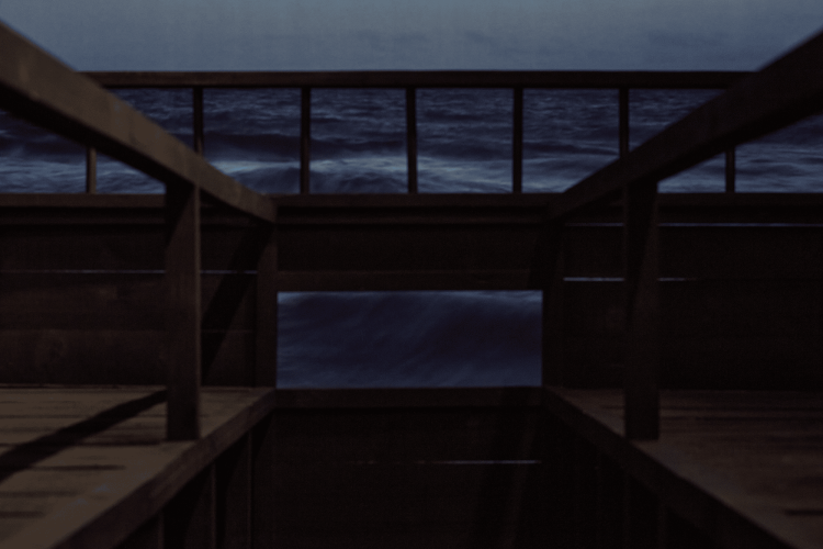 Stanley Wany, For those who Chose the Sea, 2022, Mixed media installation, dimensions variable. Includes: 3 x mixed-media illustration/painting on Strathmore paper, 100.6 cm x 152.4 cm (each); video edited by Stanley Wany, footage captured by Frederick Murphy, 15 minutes; wooden structure: Peter Shmelzer. Courtesy of the artist, and supported by the Canada Council for the Arts. Installation at the Ottawa Art Gallery, 2022. Photo: Rémi Thériault
