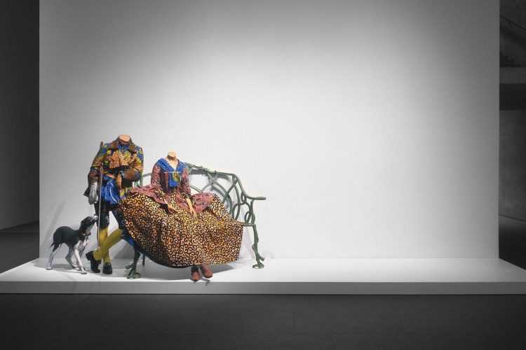 Yinka Shonibare CBE, RA Mr. and Mrs. Andrews without their Heads, 1998, two life-size mannequins, bench, gun, dog, Dutch wax printed cotton, , 165 x 635 x 254 cm. National Gallery of Canada, Ottawa. © Yinka Shonibare CBE. All Rights Reserved DACS/Artimage 2022. Photo: NGC